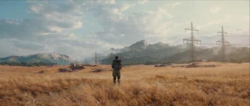 A scene from Time Ghost, a real-time HDRP cinematic created with Unity 6. A figure stands with their back to the camera, against a vast open field with a mountain range in the far distance.